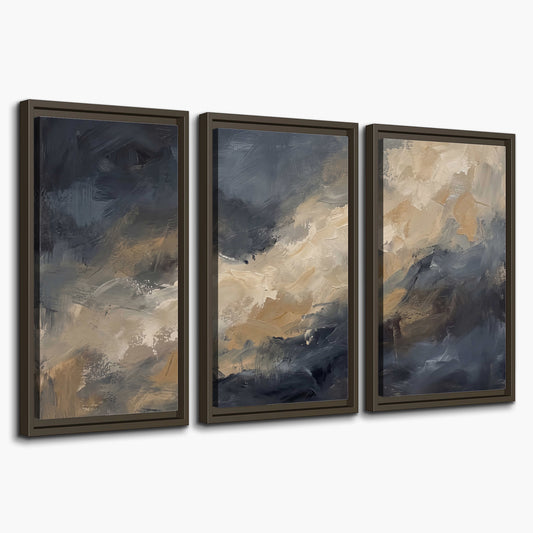 Sweeping charcoal and cream painted clouds with warm gold tones 3 piece framed canvas wall art on a white background