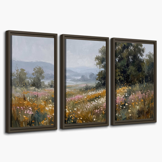 A flower-filled meadow overlooking soft blue mountain ridges 3 piece framed canvas wall art on a white background