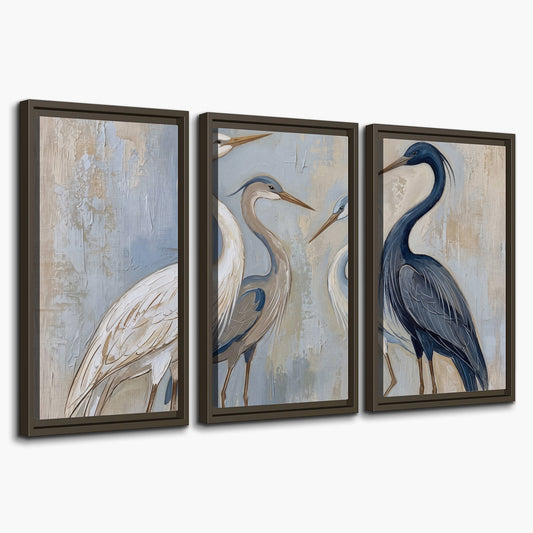 Three long-necked herons in soft ivory and dark blue against pale blue-gray 3 piece framed canvas wall art on a white background