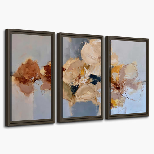 Loose ivory and ochre flower forms layered over a pale blue painterly background 3 piece framed canvas wall art on a white background