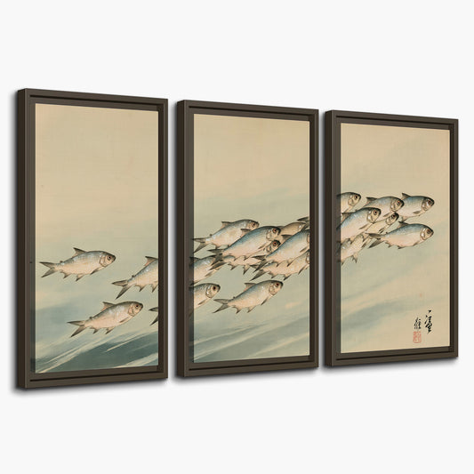 A flowing school of small fish above pale blue water on a cream ground 3 piece framed canvas wall art on a white background