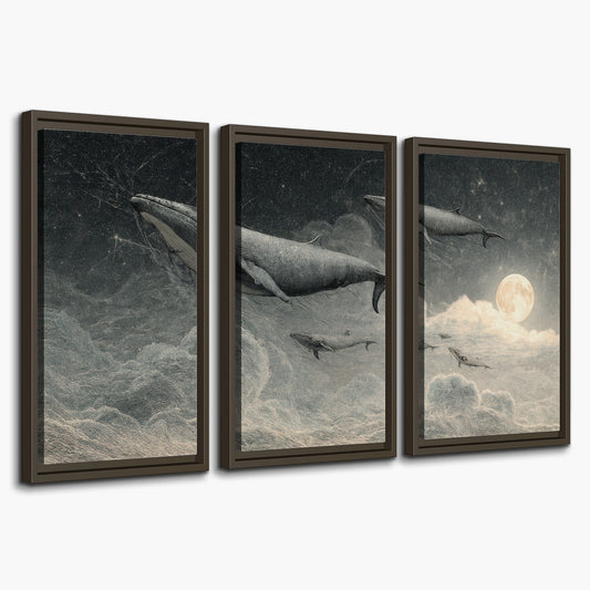 Monochrome whales floating over misty clouds beside a luminous painted moon 3 piece framed canvas wall art on a white background