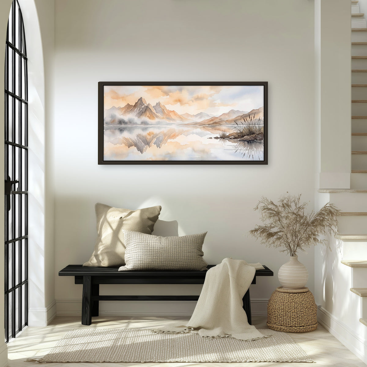 Watercolor mountain lake painting framed canvas wall art in an entryway above a bench