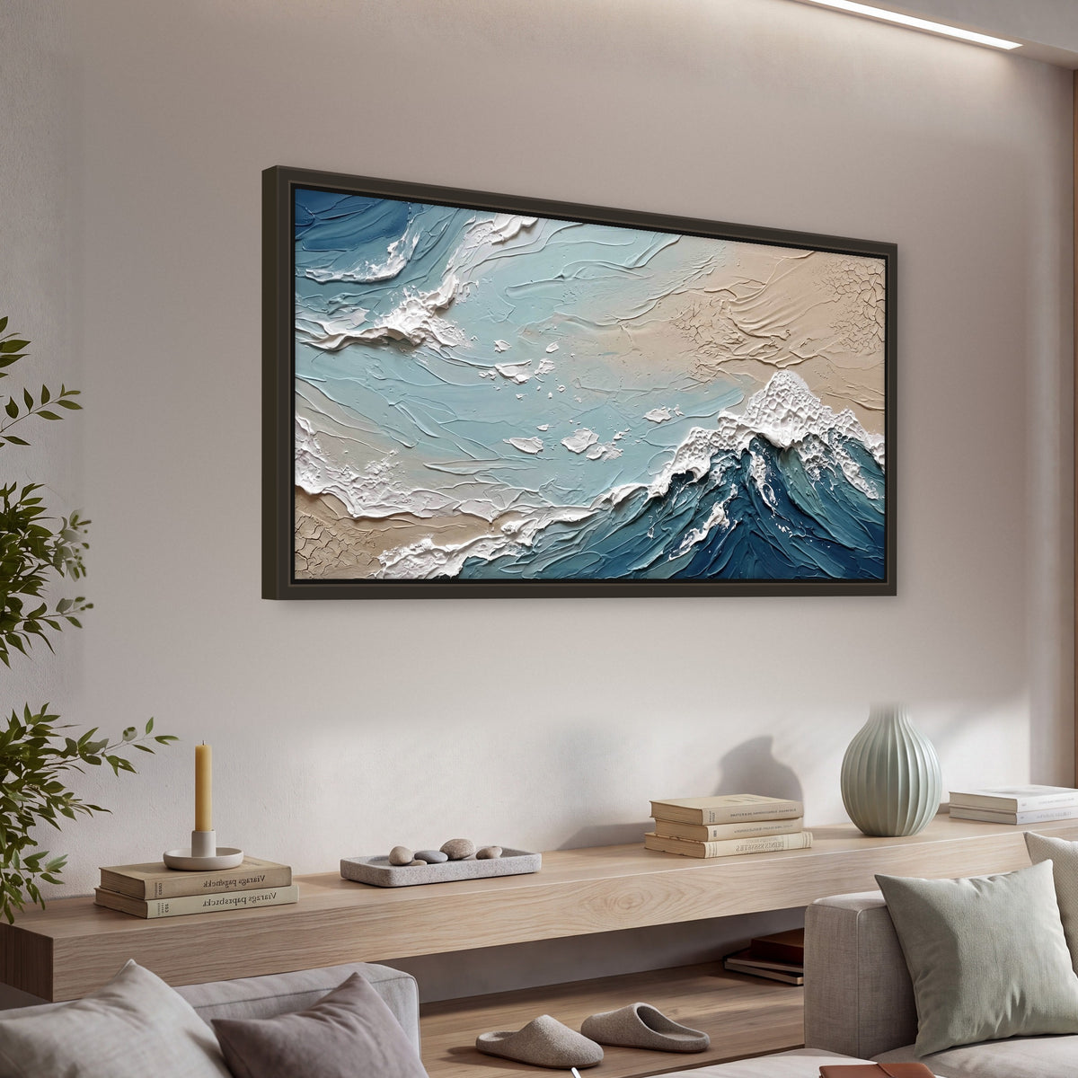 Textured ocean wave painting framed canvas wall art in a living room above a console