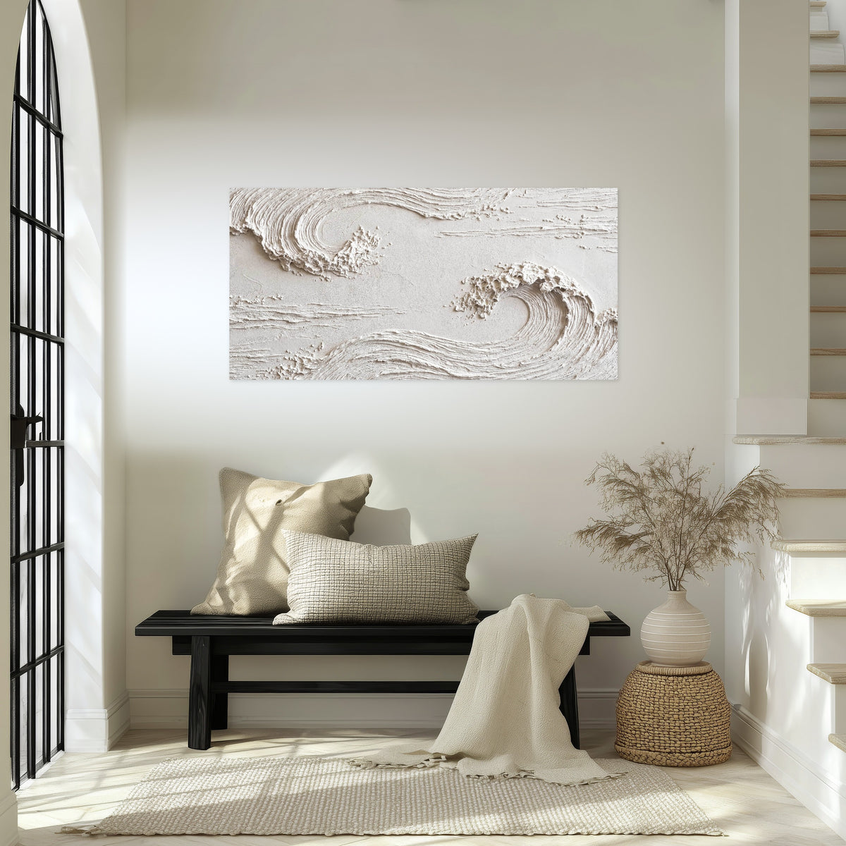 White plaster wave art poster print in an entryway above a bench