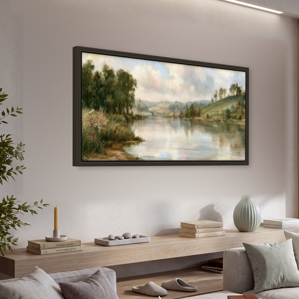 Pastel river valley painting framed canvas wall art in a living room above a console