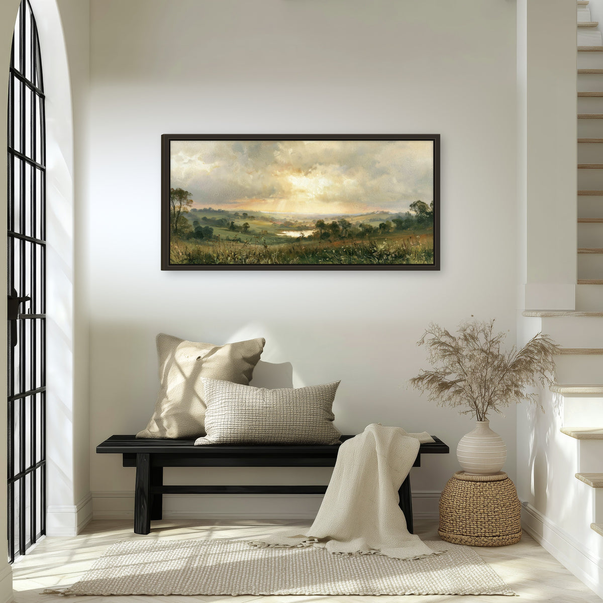 Sunbeams over countryside painting framed canvas wall art in an entryway above a bench