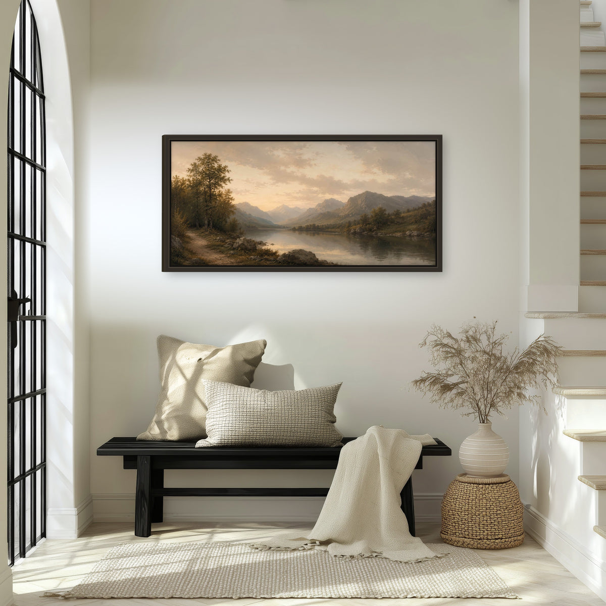 Golden mountain lake painting framed canvas wall art in an entryway above a bench