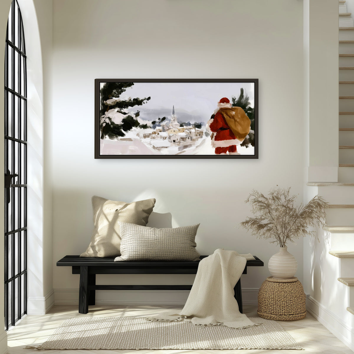 Santa Claus snowy village painting framed canvas wall art in an entryway above a bench