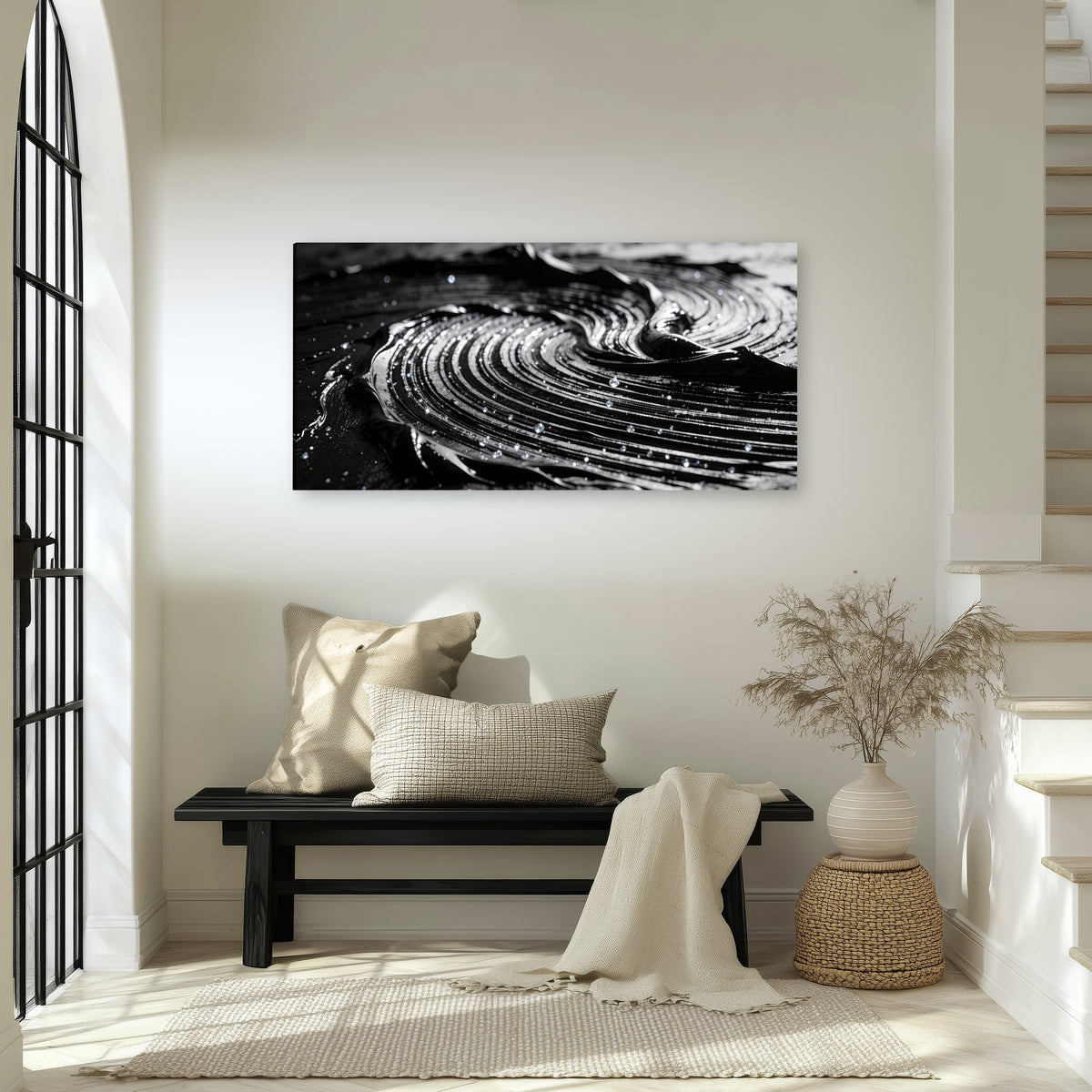 Black and silver swirl abstract painting canvas wall art in an entryway above a bench