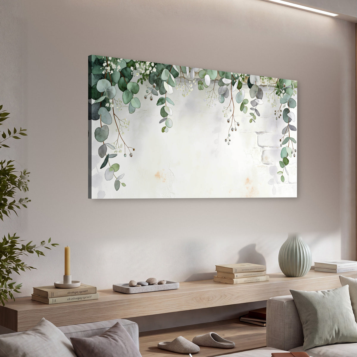 Watercolor eucalyptus greenery painting canvas wall art in a living room above a console