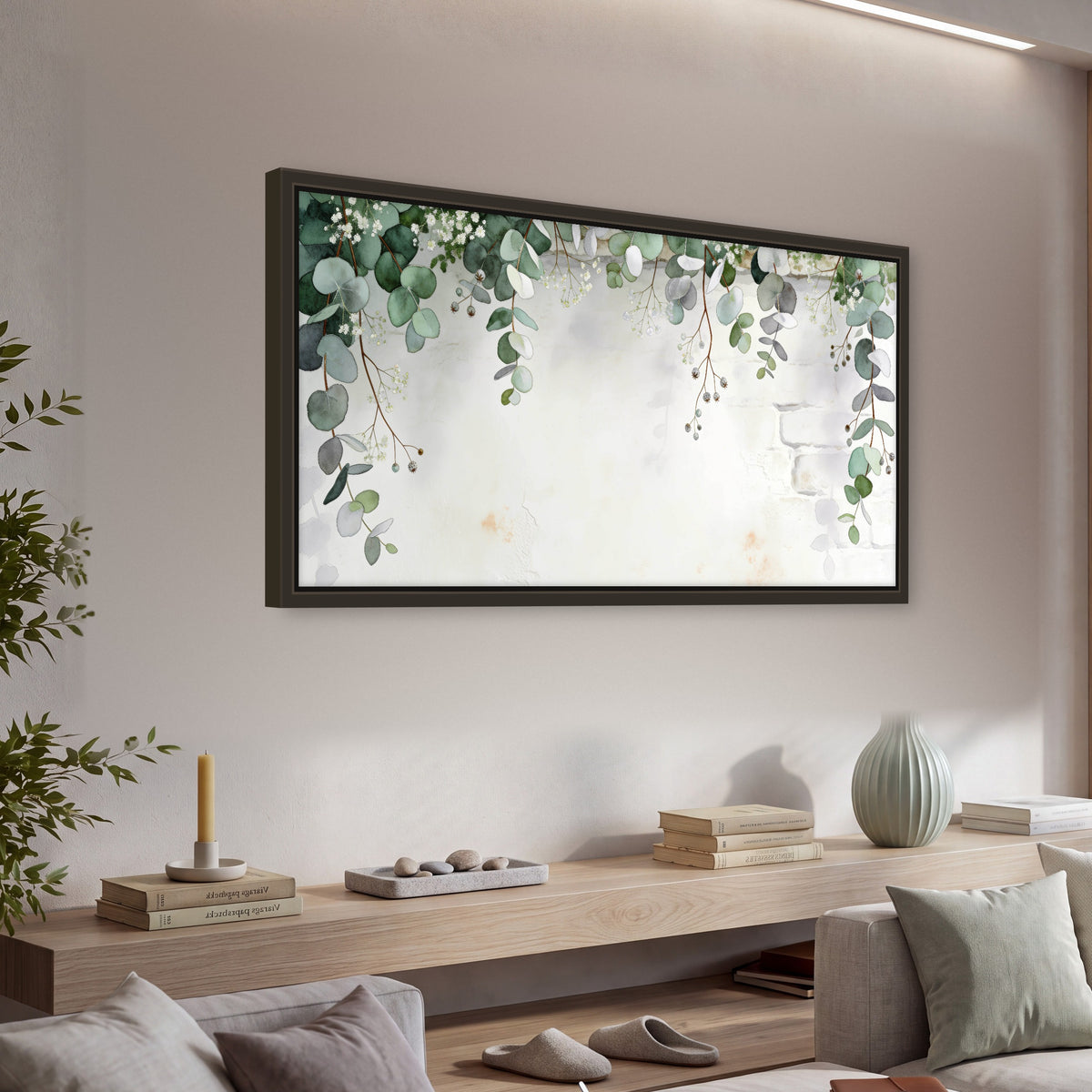 Watercolor eucalyptus greenery painting framed canvas wall art in a living room above a console