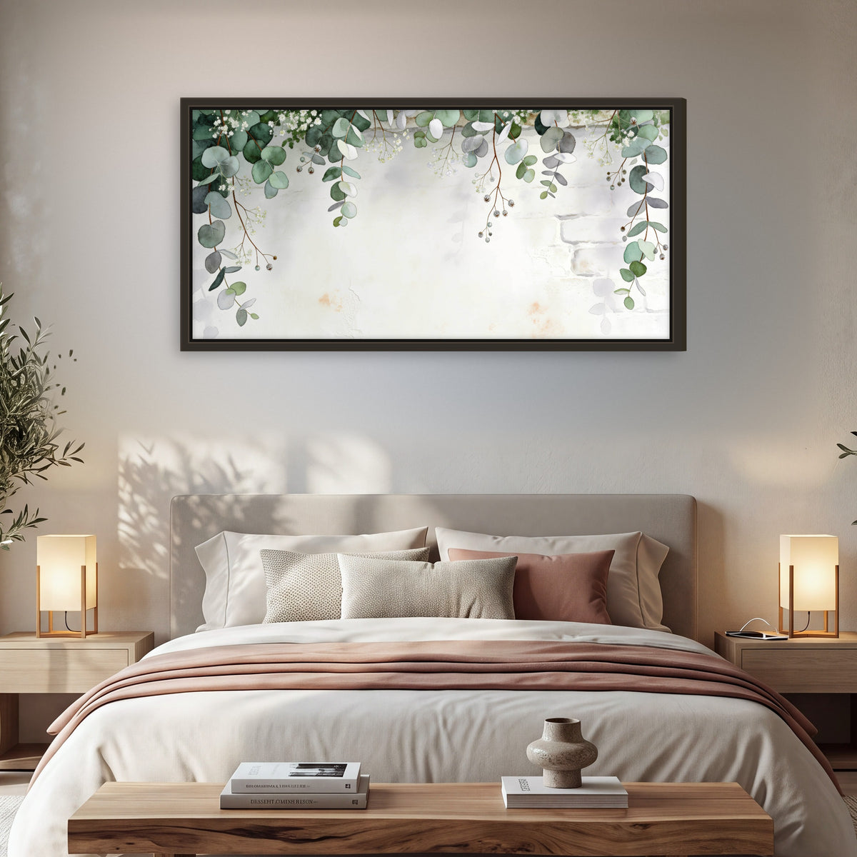 Watercolor eucalyptus greenery painting framed canvas wall art in a bedroom above the bed