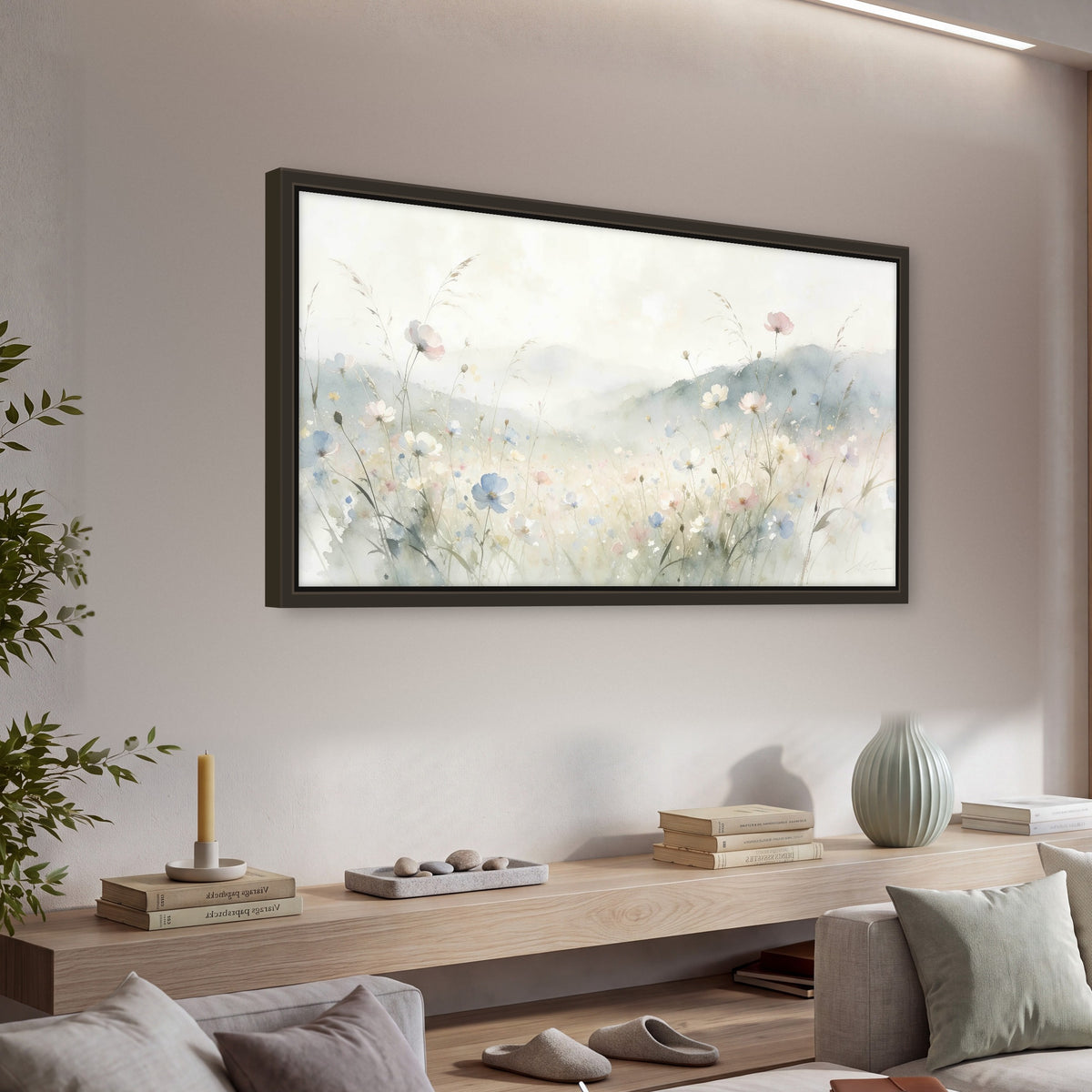 Watercolor wildflower meadow painting framed canvas wall art in a living room above a console