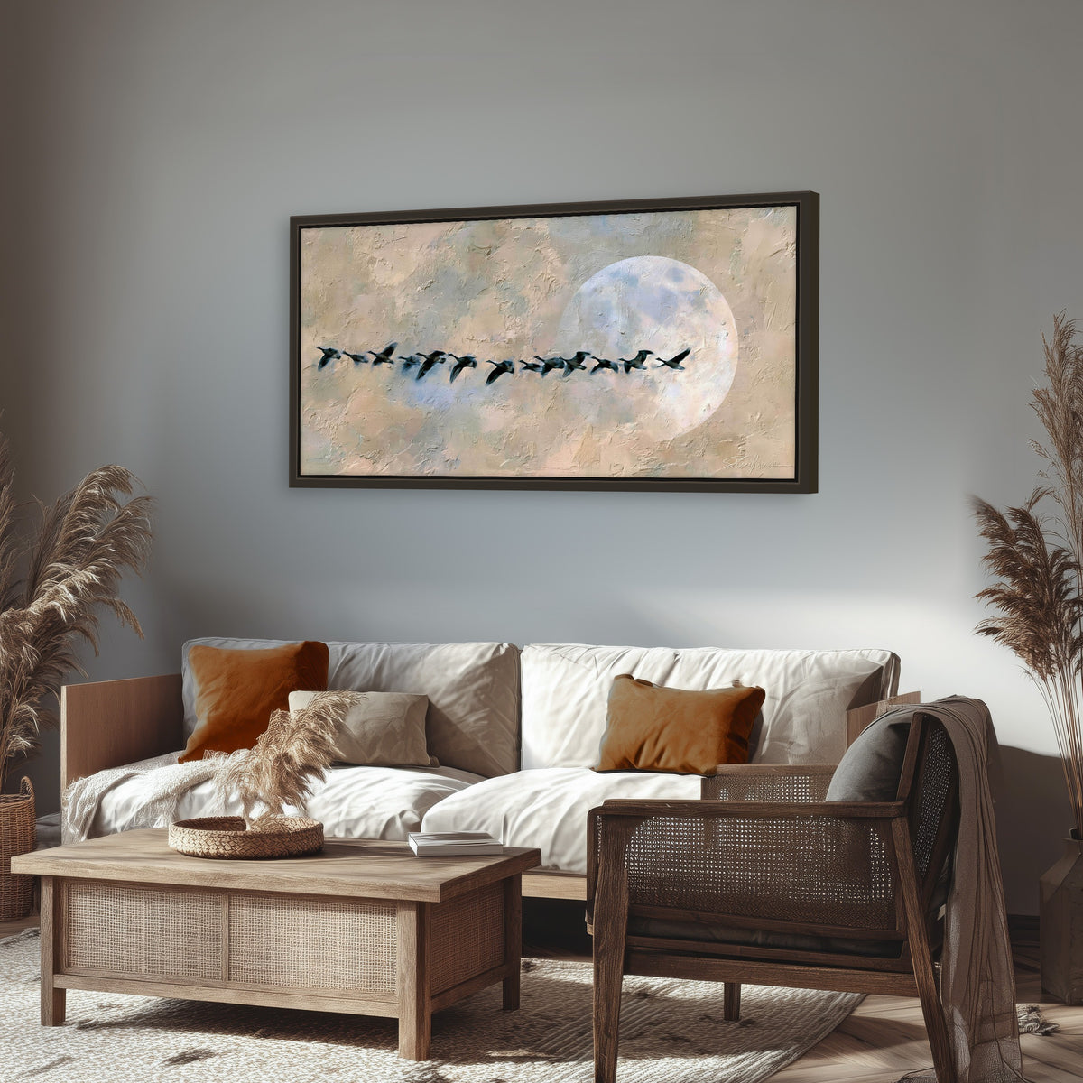 Geese flying across the moon painting framed canvas wall art in a rustic living room