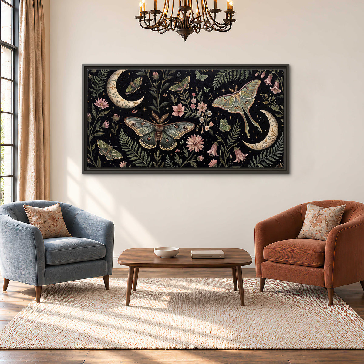Decorative moths, crescent moons and flowers on black single framed canvas wall art styled in an interior
