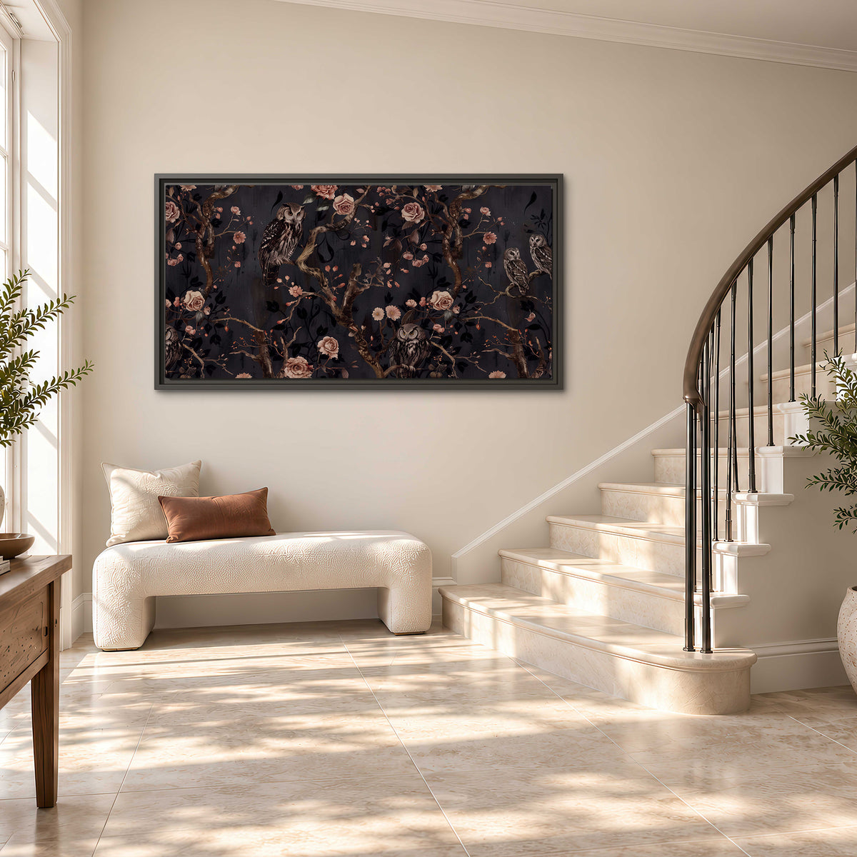 Owls among curling branches and dusty pink flowers on dark gray single framed canvas wall art styled in an interior