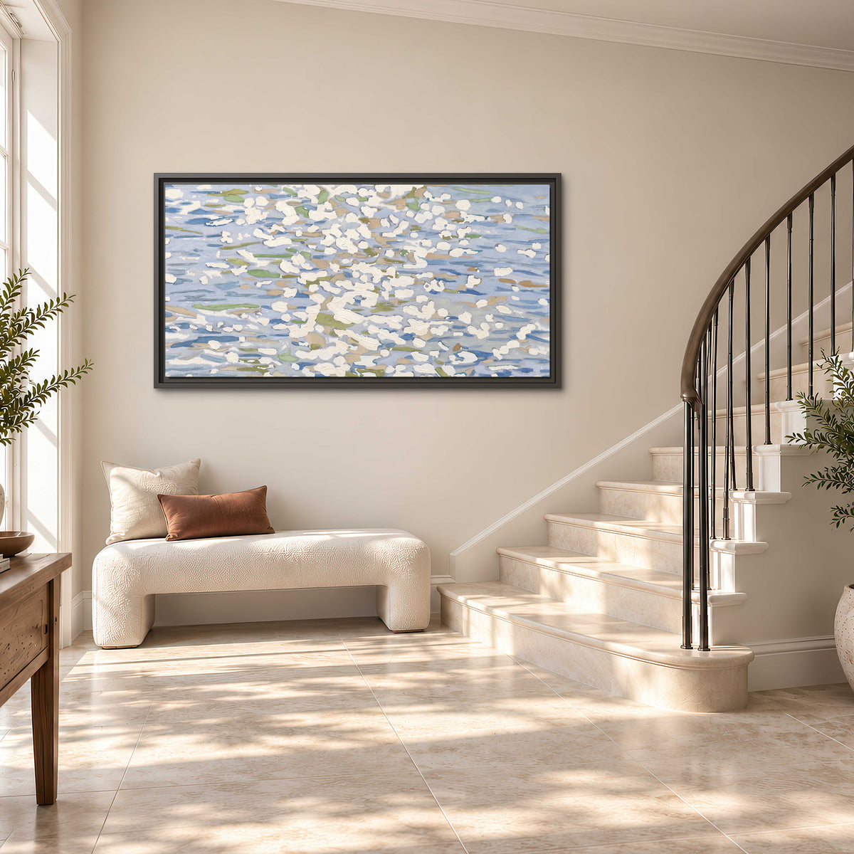 Loose pale blue, white and soft green marks suggesting shimmering water single framed canvas wall art styled in an interior