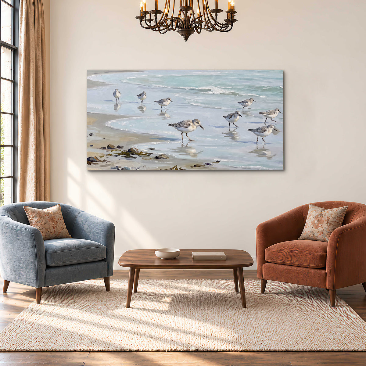 Small shorebirds standing along a pale blue shoreline single canvas wall art styled in an interior