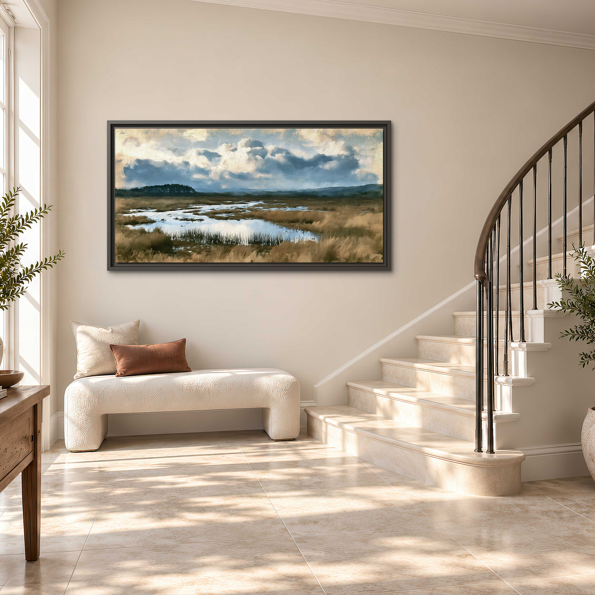 A wide open marsh with blue water and warm grasses beneath layered clouds single framed canvas wall art styled in an interior