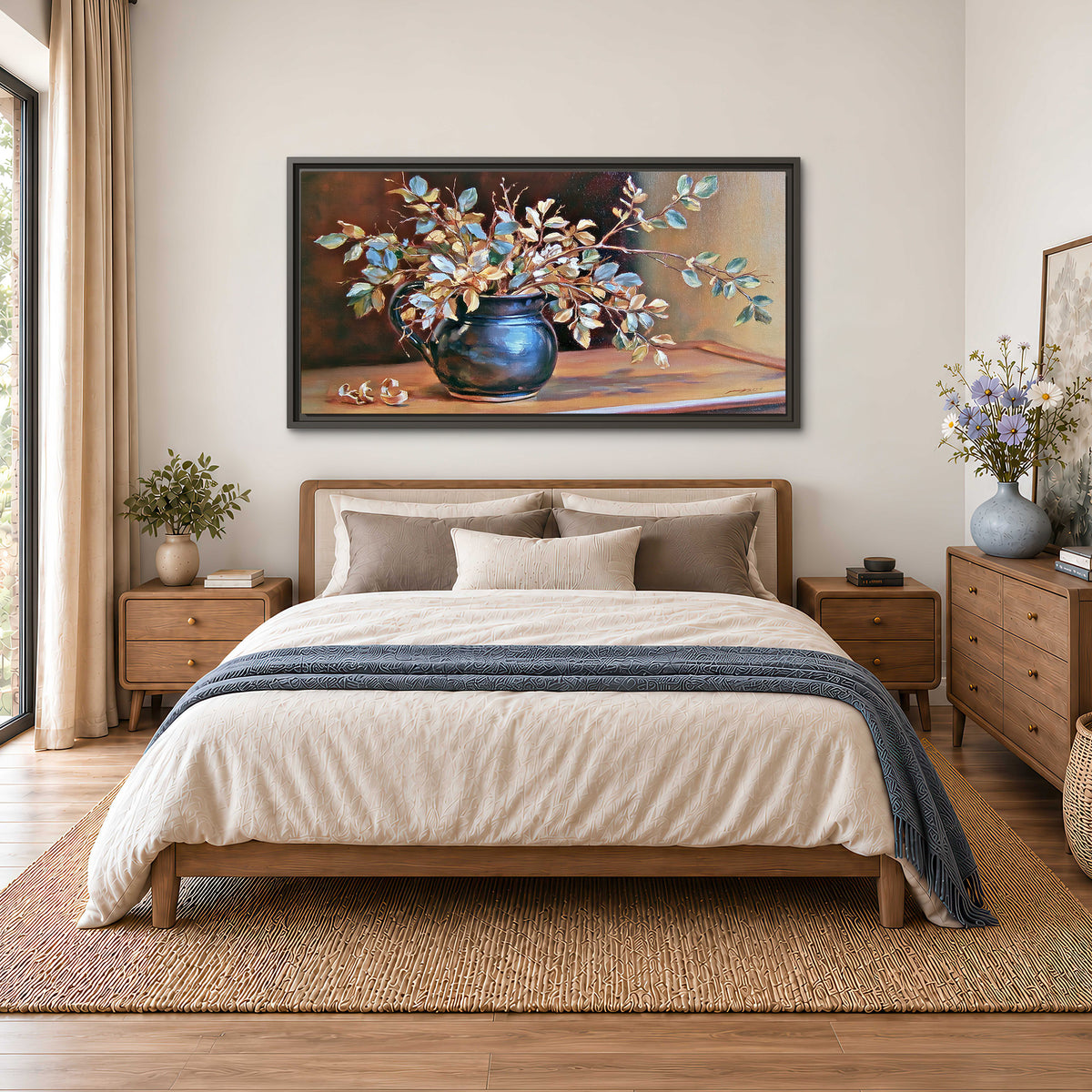 White and peach flowering branches arranged in a blue vase against a warm ochre background single framed canvas wall art styled in an interior