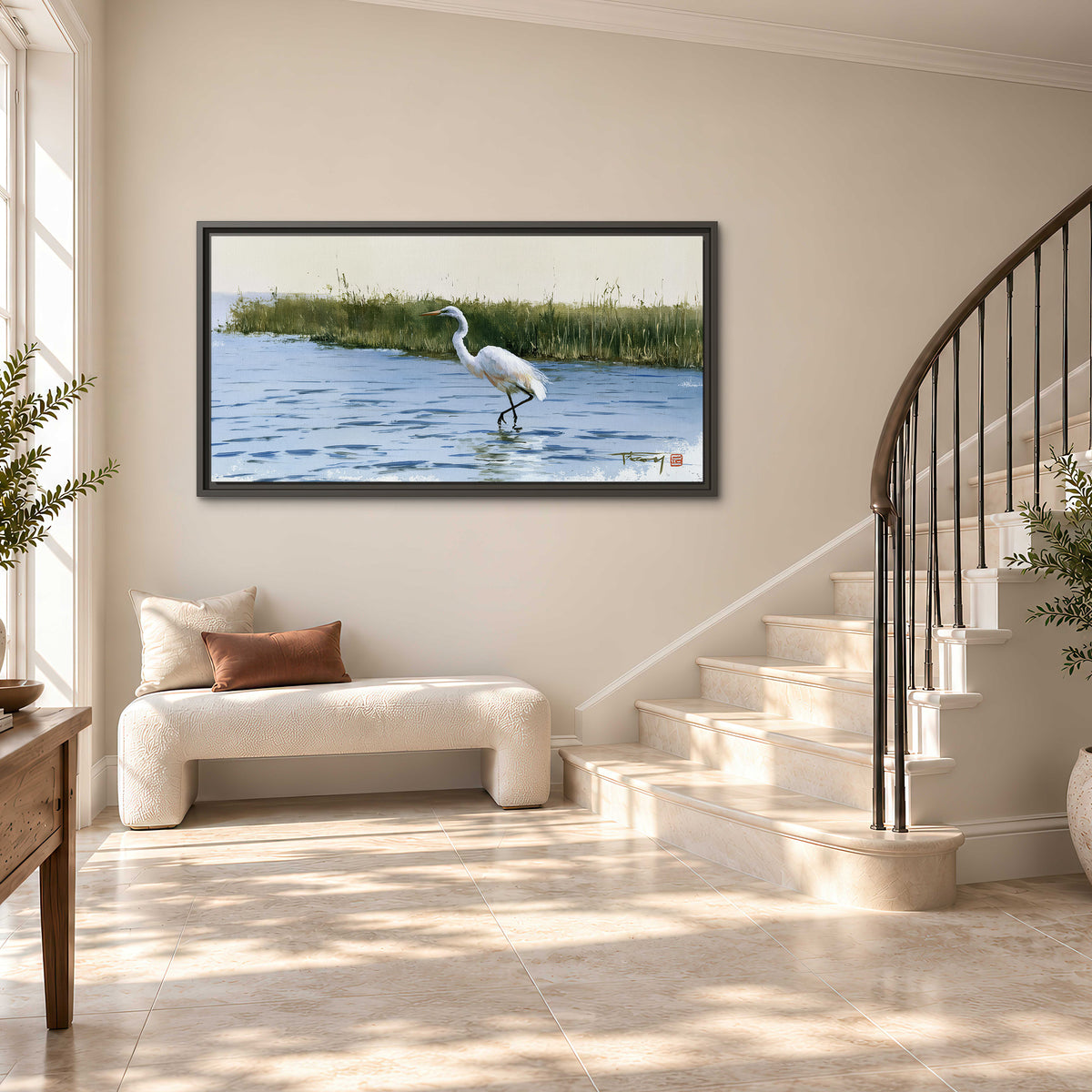 A white heron wading through bright blue water beside green reeds single framed canvas wall art styled in an interior