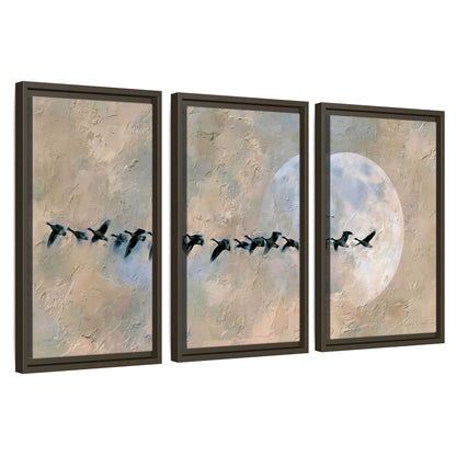 Geese flying across the moon painting 3 piece framed canvas wall art set on a white background
