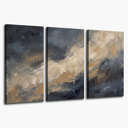 Sweeping charcoal and cream painted clouds with warm gold tones 3 piece canvas wall art on a white background