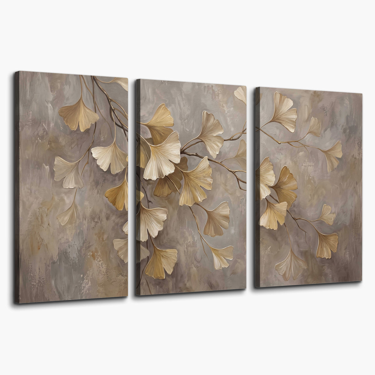 Cream and gold-colored ginkgo leaves against warm gray 3 piece canvas wall art on a white background