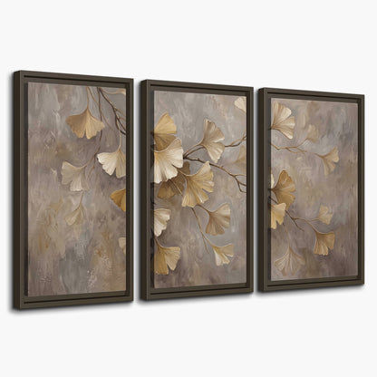 Cream and gold-colored ginkgo leaves against warm gray 3 piece framed canvas wall art on a white background