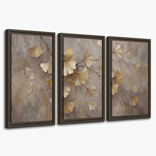 Cream and gold-colored ginkgo leaves against warm gray 3 piece framed canvas wall art on a white background