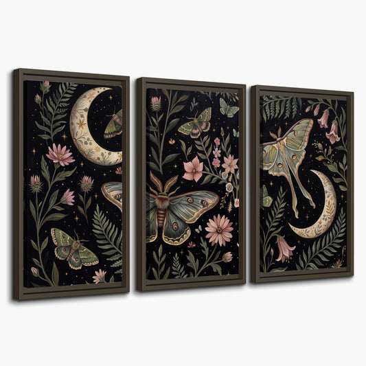 Decorative moths, crescent moons and flowers on black 3 piece framed canvas wall art on a white background