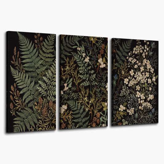 Layered green ferns and delicate cream flowers on a black background 3 piece canvas wall art on a white background