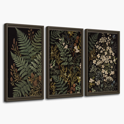 Layered green ferns and delicate cream flowers on a black background 3 piece framed canvas wall art on a white background