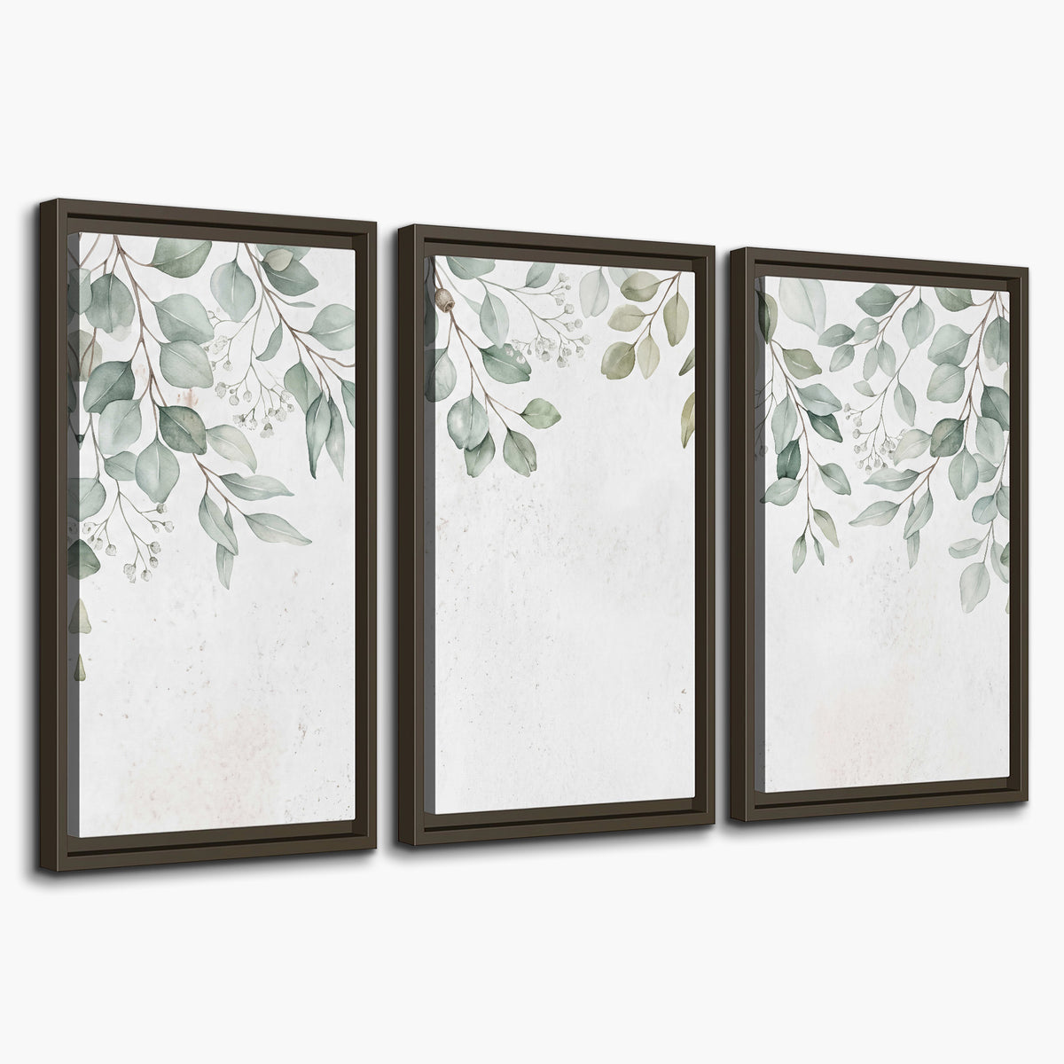 Pale sage eucalyptus leaves against a light background 3 piece framed canvas wall art on a white background