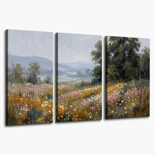 A flower-filled meadow overlooking soft blue mountain ridges 3 piece canvas wall art on a white background