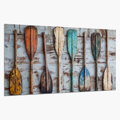 A row of colorful weathered wooden oars against pale blue boards single poster print on a white background