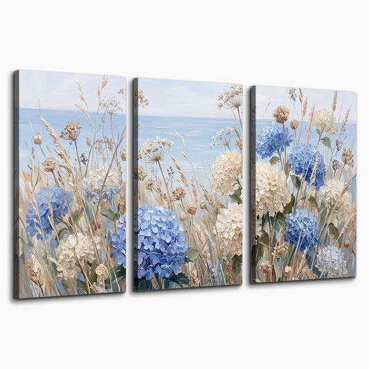 Blue hydrangeas and delicate ivory wildflowers beneath a pale blue sky 3 piece canvas wall art on a white background