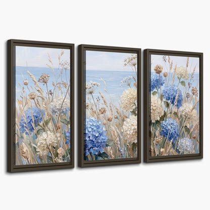 Blue hydrangeas and delicate ivory wildflowers beneath a pale blue sky 3 piece framed canvas wall art on a white background