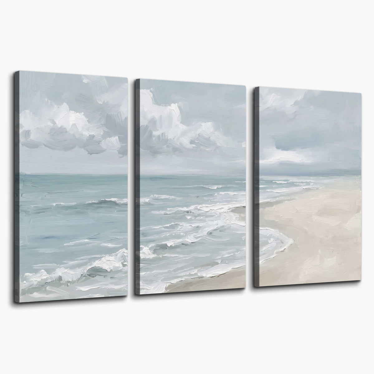 Gentle pale blue waves washing across a light sandy beach 3 piece canvas wall art on a white background