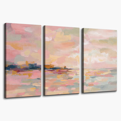 Pink, peach and yellow painted-style sky and water reflections 3 piece canvas wall art on a white background