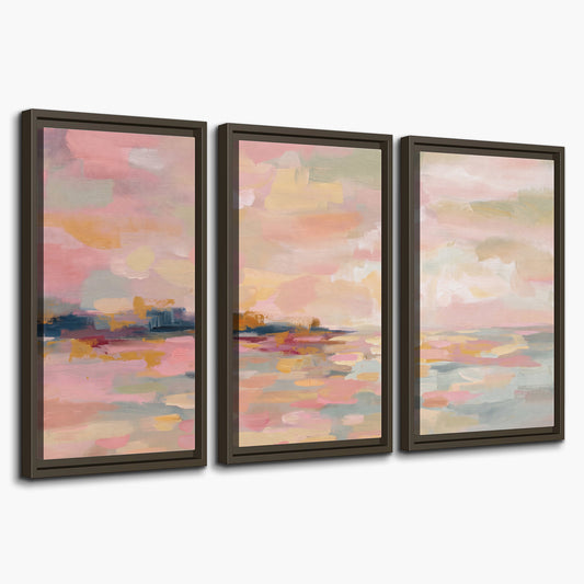 Pink, peach and yellow painted-style sky and water reflections 3 piece framed canvas wall art on a white background
