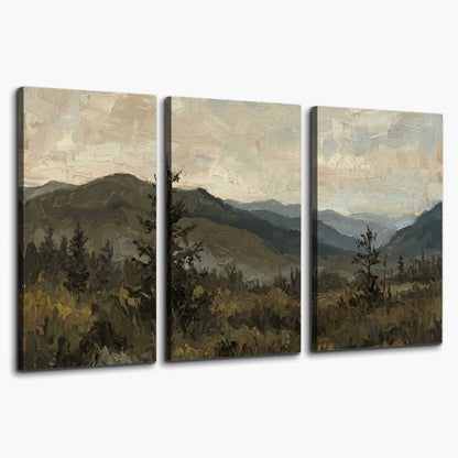 Layered mountain ridges and dark evergreen trees beneath a muted cloudy sky 3 piece canvas wall art on a white background