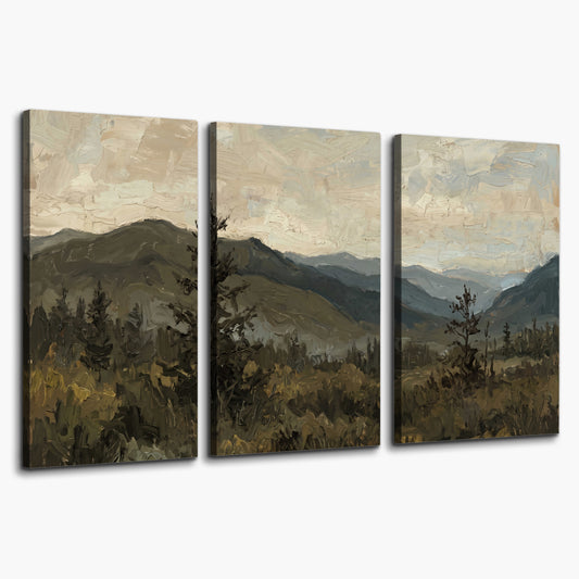 Layered mountain ridges and dark evergreen trees beneath a muted cloudy sky 3 piece canvas wall art on a white background