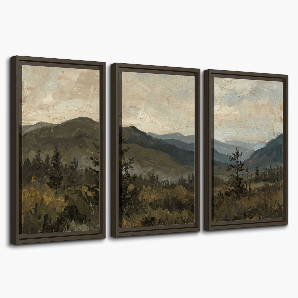 Layered mountain ridges and dark evergreen trees beneath a muted cloudy sky 3 piece framed canvas wall art on a white background