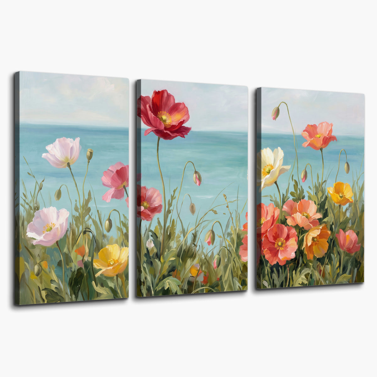 Colorful red, peach and yellow flowers beside a turquoise sea 3 piece canvas wall art on a white background