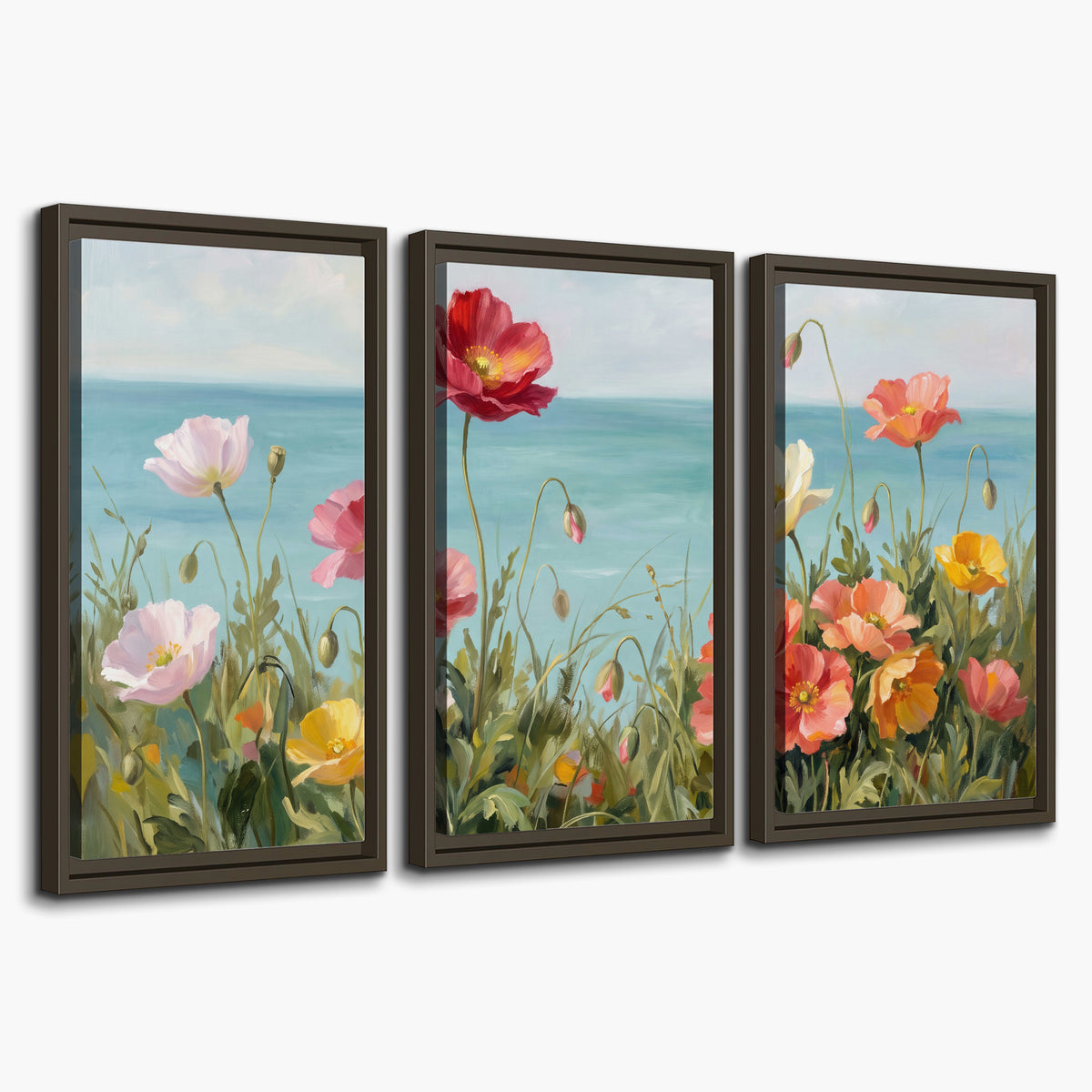Colorful red, peach and yellow flowers beside a turquoise sea 3 piece framed canvas wall art on a white background