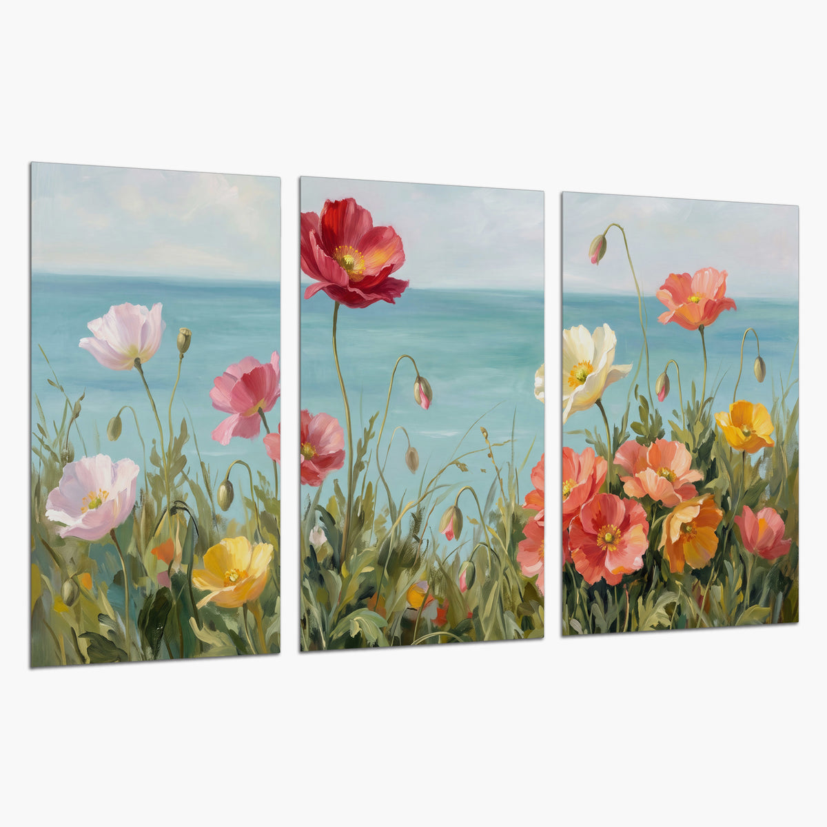 Colorful red, peach and yellow flowers beside a turquoise sea set of 3 poster prints on a white background