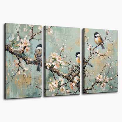 Small colorful songbirds perched among pale blossoms on soft aqua 3 piece canvas wall art on a white background
