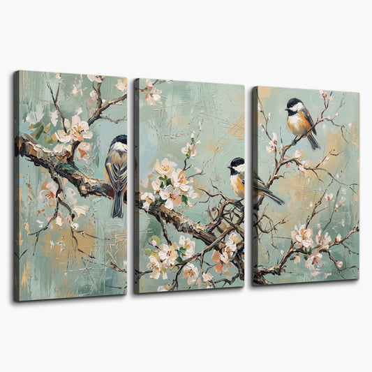 Small colorful songbirds perched among pale blossoms on soft aqua 3 piece canvas wall art on a white background